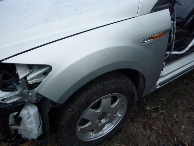 FORD MONDEO MK4 BŁOTNIK LEWY KOLOR BA7